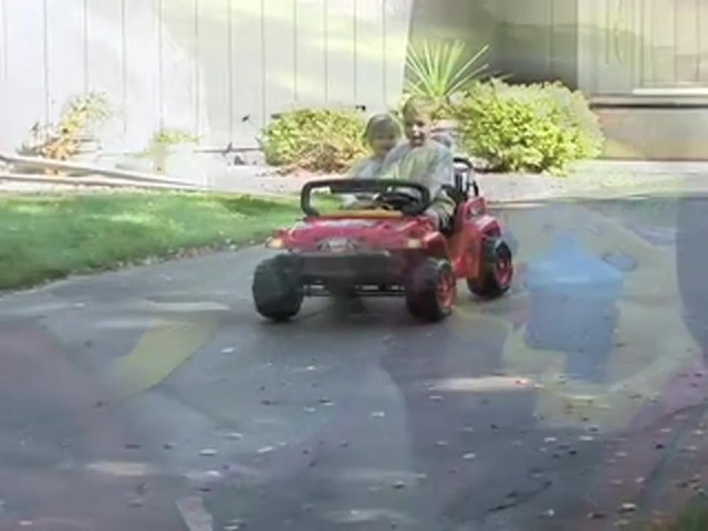 Mighty Wheelz 12V Vehicle Red / Yellow / Black  - image 8 from the video